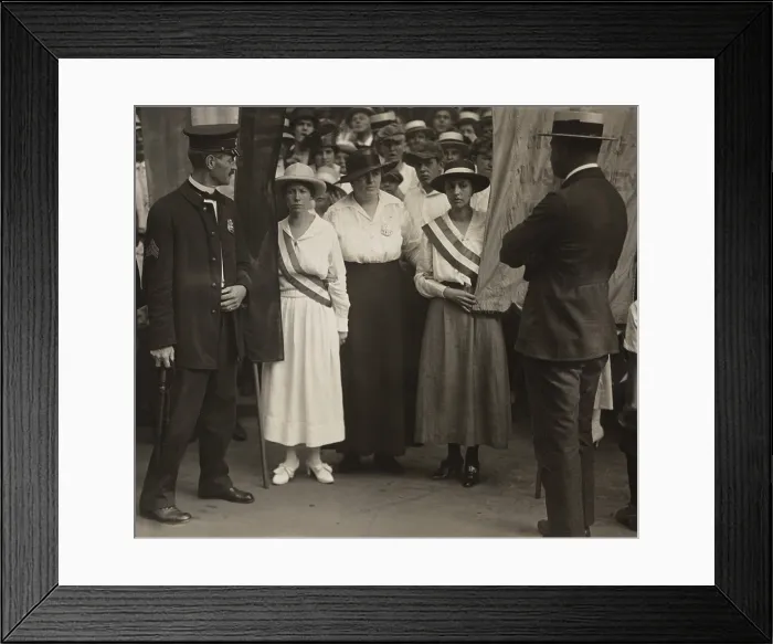Framed Print : Suffragists Catherine Flanagan (left) and Madeleine Watson (right) of the militant National Woman's Party being arrested as they picket the White House East Gate