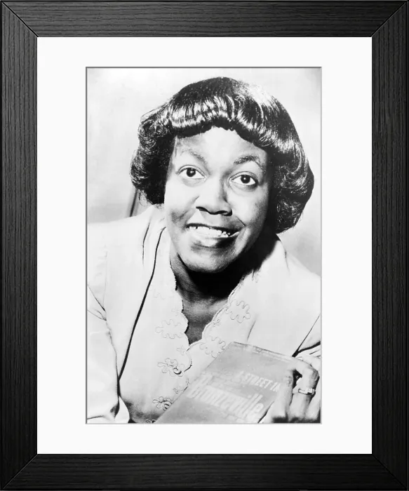 Framed Print : Gwendolyn Brooks (1917-2000) holding her book, 'A Street in Bronzeville, ' her first book of poetry published in 1945