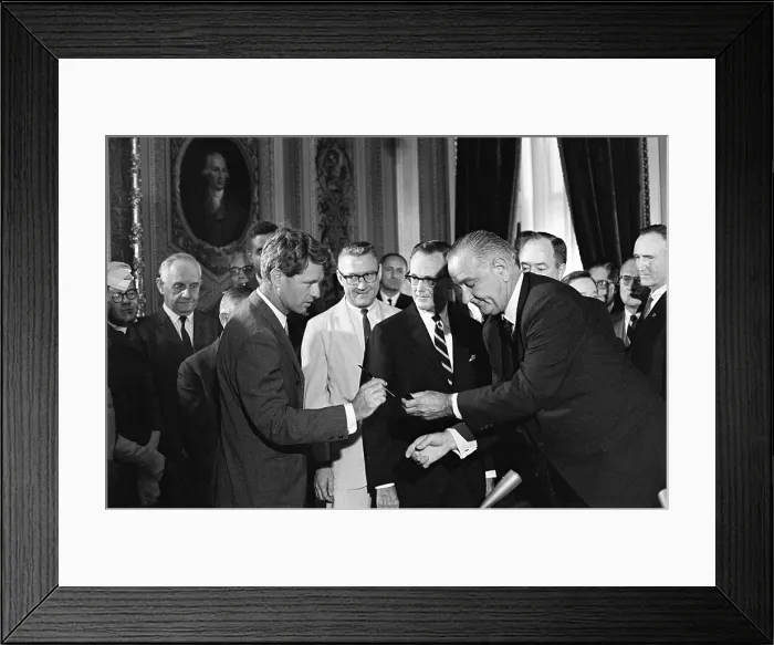 Framed Print : 1965 Voting Rights signing ceremony. President Lyndon Johnson handing a signing pen to Robert Kennedy as others look on. August 6, 1965