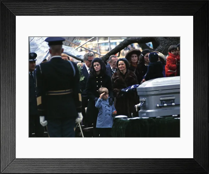 Framed Print : Lyndon Johnson funeral. Lyn Nugent salutes his grandfather's coffin at Johnson Family Cemetery at the LBJ Ranch