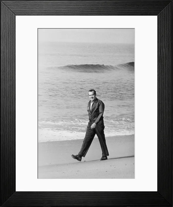 Framed Print : Richard Nixon walking on the beach in San Clemente. Ca. 1969-74