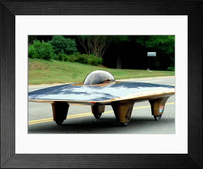 Framed Print : Solar car on the road during the SUNRAYCE 1999 race of experimental solar vehicles from Washington, D.C. to Orlando Florida in June 1999 Framed Print : Solar car on the road during the SUNRAYCE 1999 race of experimental solar vehicles from Washington, D.C. to Orlando Florida in June 1999