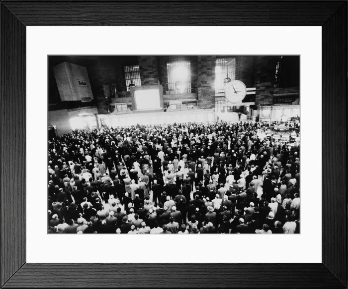 Framed Print : Hundreds of people gathered before a large screen television in New York's Grand Central Station to watch coverage of President Kennedy's funeral on November 25, 1963