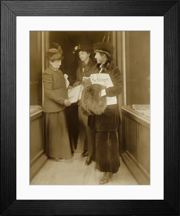 Framed Print : Jeanette Rankin, with hat, fur muff, and several issues of THE SUFFRAGIST, the magazine of the militant National Women's Party with two women Framed Print : Jeanette Rankin, with hat, fur muff, and several issues of THE SUFFRAGIST, the magazine of the militant National Women's Party with two women