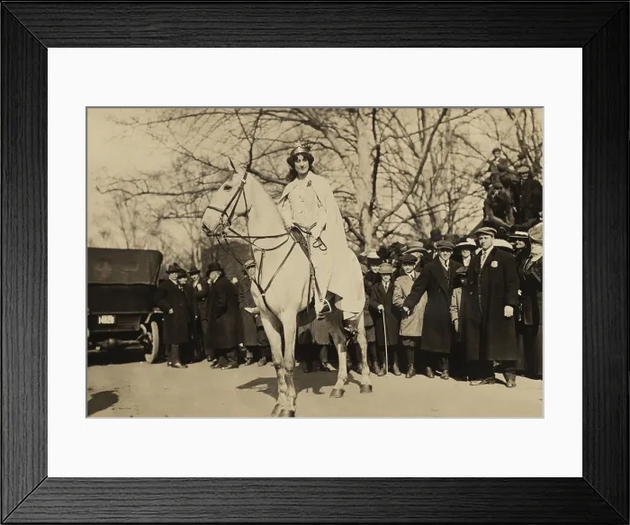 Framed Print : Inez Milholland, wearing white robes and a crown riding a white horse as the Herald in the Women's Suffrage parade of March 3, 1913 Framed Print : Inez Milholland, wearing white robes and a crown riding a white horse as the Herald in the Women's Suffrage parade of March 3, 1913