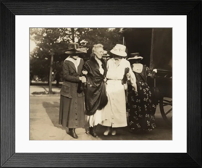 Framed Print : National Woman's Party activist, the elderly Dora Lewis, wrapped in blanket, is supported after release the Washington, D.C