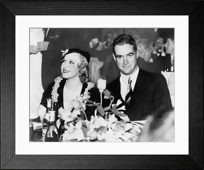 Framed Print : Howard Hughes dated and was engaged to actress Ginger Rogers in the late 1930s. Photo shows them dining in the Gold Room at the Beverly Wilshire Hotel in 1937