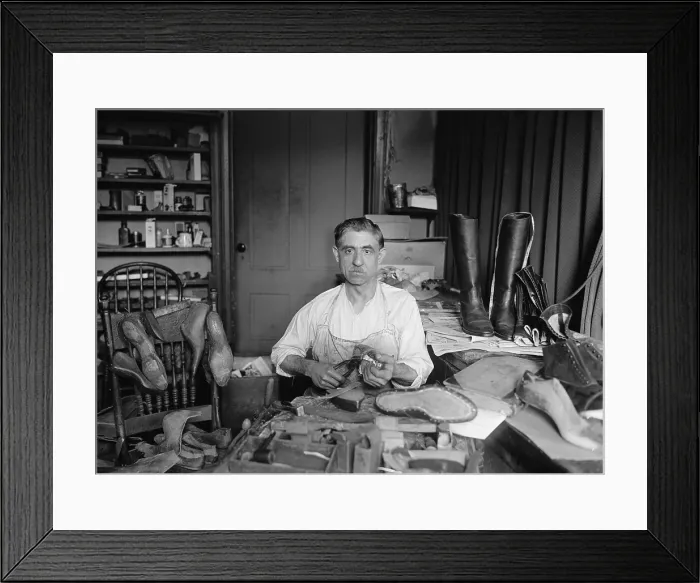 Framed Print : Traditional shoemaker in his workshop is Tony Bruno of Washington, D.C. who made and repaired shoes for presidents and politicians. 1925