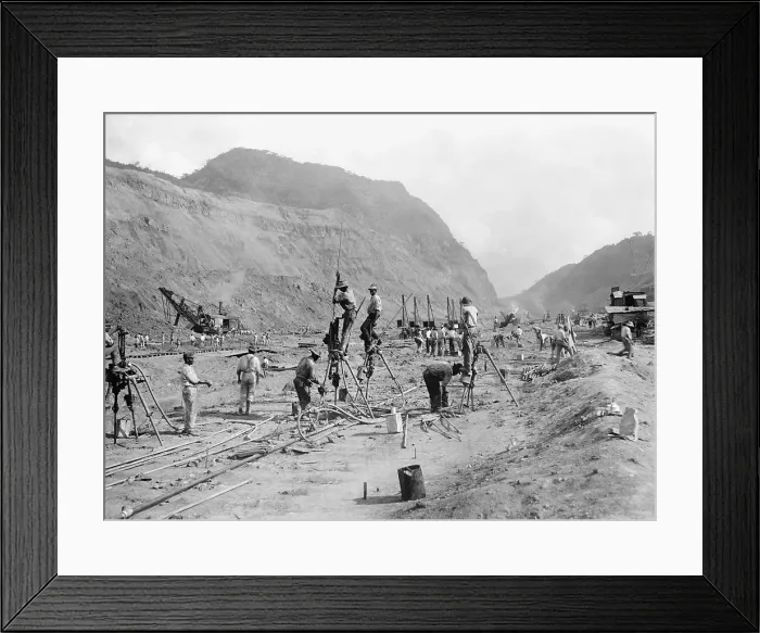 Framed Print : Panama Canal construction showing workers drilling holes for dynamite in bedrock, as they cut through the mountains of the Isthmus