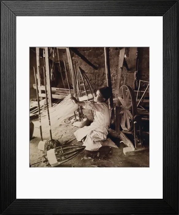 Framed Print : Young boy unwinding silk cocoons and reeling silk threads with pre-industrial tools in his Syrian home in 1914