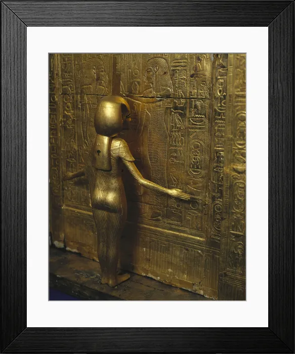 Framed Print : Canopic chest of Tutankhamun. 1333 BC. The goddess Isis shelters the dead Pharaoh. Inside the chest there was another alabaster chest with canopic vases. Golden wood
