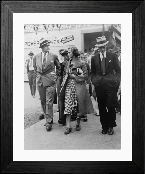 Framed Print : Ann Burlak (1911-2002), self-proclaimed communist revolutionary, leaving a striker's rally with reporters after she was refused permission to speak