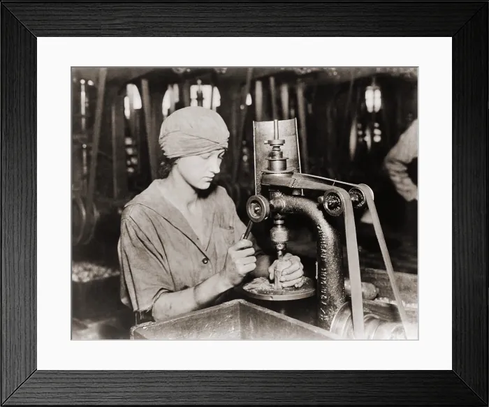 Framed Print : Woman countersinking a detonator tube hole in hand grenade at Westinghouse Electric & Manufacturing. Company, during World War I