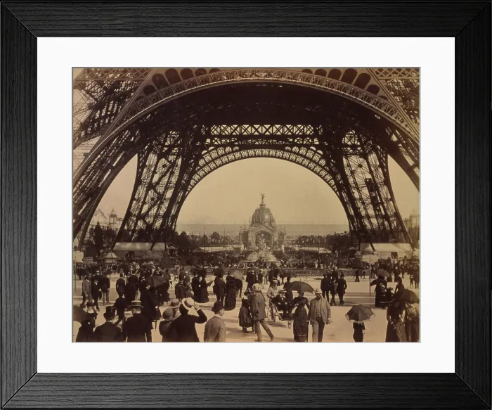 Framed Print : Eiffel Tower, view toward the Central Dome, Paris Exposition, with a crowd of people walking under its arched base. 1889