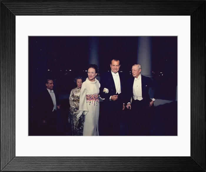 Framed Print : President Nixon greets the Duke and Duchess of Windsor. The Duchess wore a white silk gown by Givenchy with a belt of colored metallic beads. April 4 1970