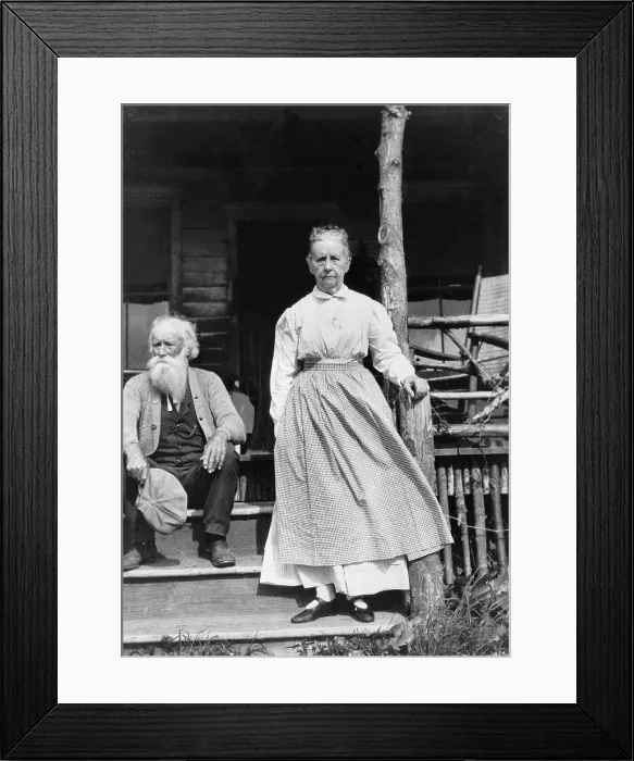 Framed Print : John Burroughs (1837-1921), American naturalist author seated on steps of house with his wife standing. 1915 Framed Print : John Burroughs (1837-1921), American naturalist author seated on steps of house with his wife standing. 1915