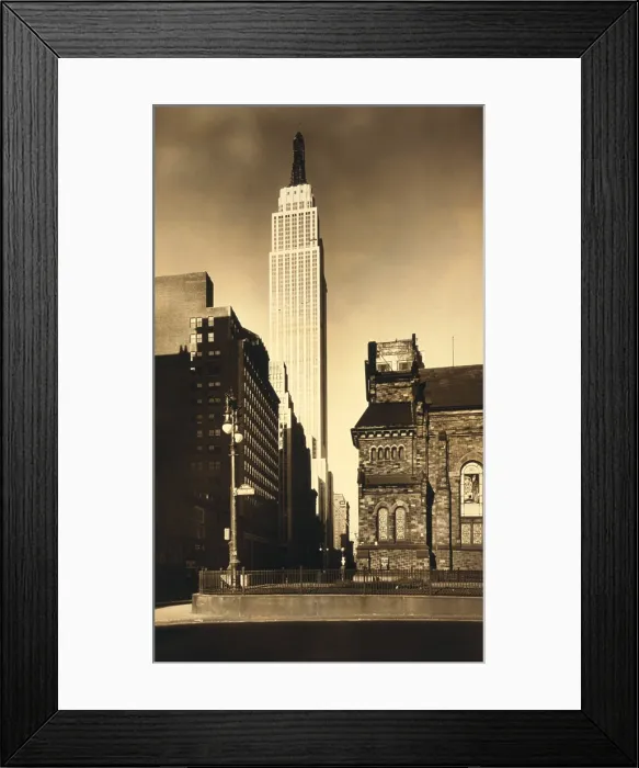 Framed Print : Empire State Building, in New York City in its final stage of construction. The tower lacks its Art Deco facing. Ca. 1930. Photo by Irving Underhill