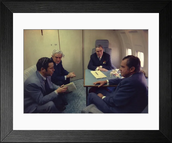 Framed Print : President Nixon Soviet leader Brezhnev talk with John Connally on the Spirit of 76 Air Force One while en route to San Clemente California. June 22 1973
