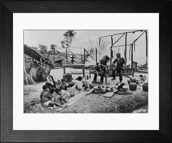 Framed Print : South Vietnamese woman and children sit amid ruins of their village, burned by government troops on suspicion of being a Viet Cong stronghold Framed Print : South Vietnamese woman and children sit amid ruins of their village, burned by government troops on suspicion of being a Viet Cong stronghold
