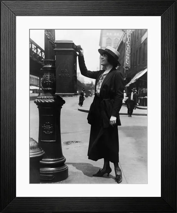 Framed Print : Merle Alcock opera contralto mailing a letter in mailbox attached to a post on a street corner. New York City ca. 1920. (BSLOC_2010_18_87) Framed Print : Merle Alcock opera contralto mailing a letter in mailbox attached to a post on a street corner. New York City ca. 1920. (BSLOC_2010_18_87)