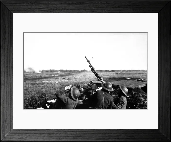 Framed Print : Anti-aircraft machine gun of 101st Field Artillery firing on a German observation plane at Plateau Chemin des Dames, France. World War I. March 5, 1918