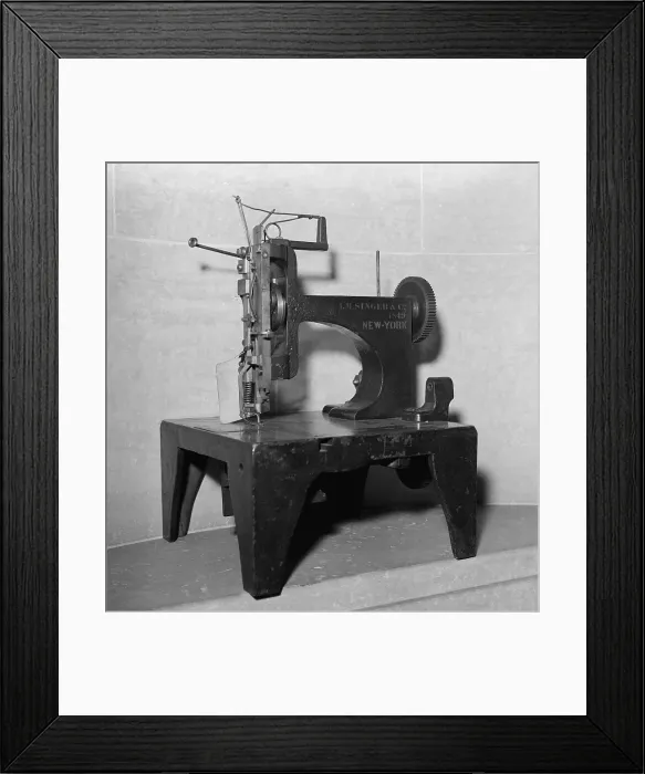 Framed Print : 1849 model of the first commercially successful sewing machine. Invented by Issac Singer, it used the lockstitch patented by Elias Howe