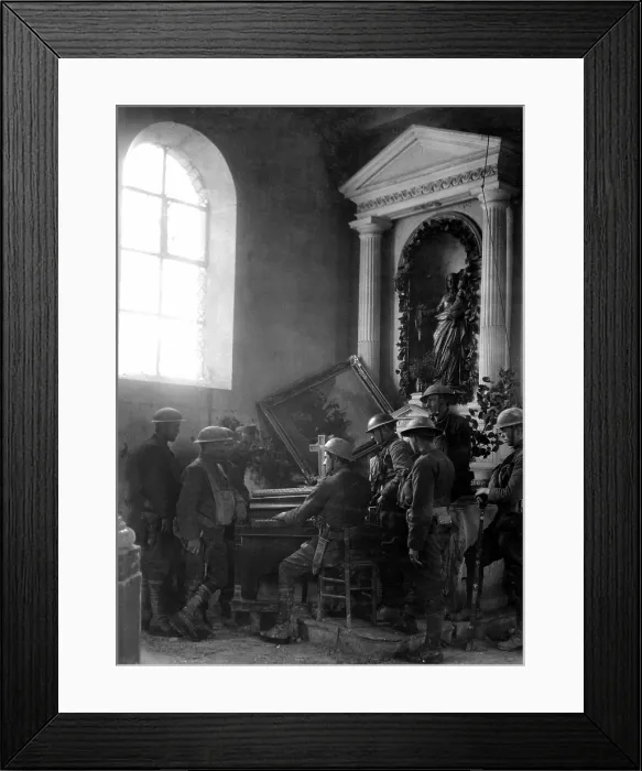 Framed Print : American World War I soldiers listen as one of their comrades plays the organ in the half-wrecked old church in Exermont, in the Argonne. Oct. 11, 1918