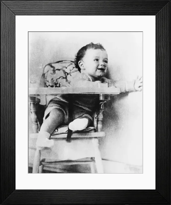 Framed Print : Charles A. Lindbergh Jr. son of the celebrated aviator, in highchair