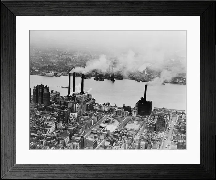 Framed Print : Smoke issues from stacks of Con Edison's coal powered electricity generating plant on the East River. New York City, February 15, 1951