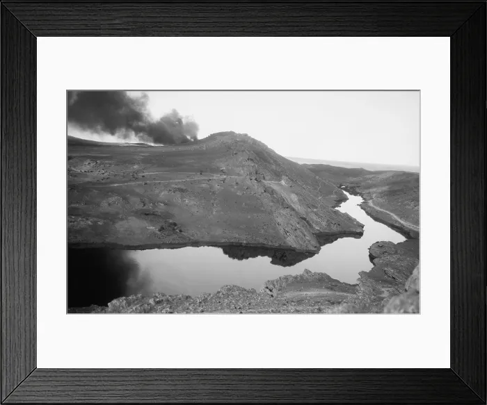 Framed Print : A river of crude oil flowing through the Iraq desert resulting from a gusher Kirkuk District of Iraq. 1932