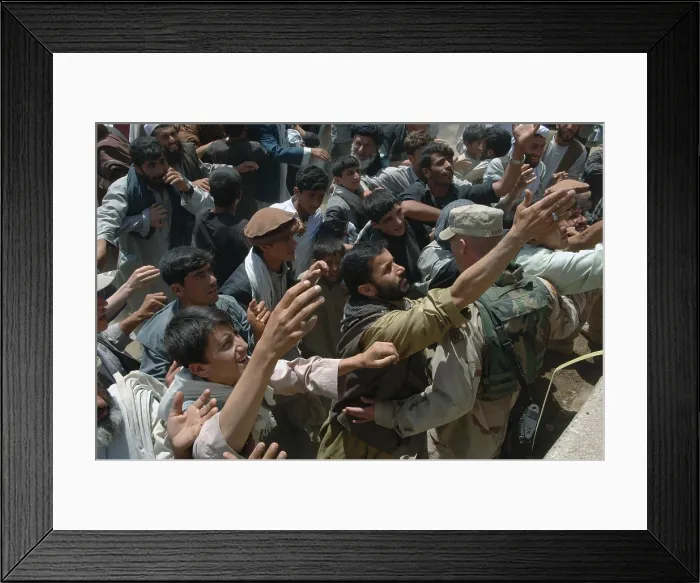 Framed Print : U.S. Army soldiers maintain order as local villager's struggle to reach humanitarian aid in the village of Nijrab Afghanistan. Aug