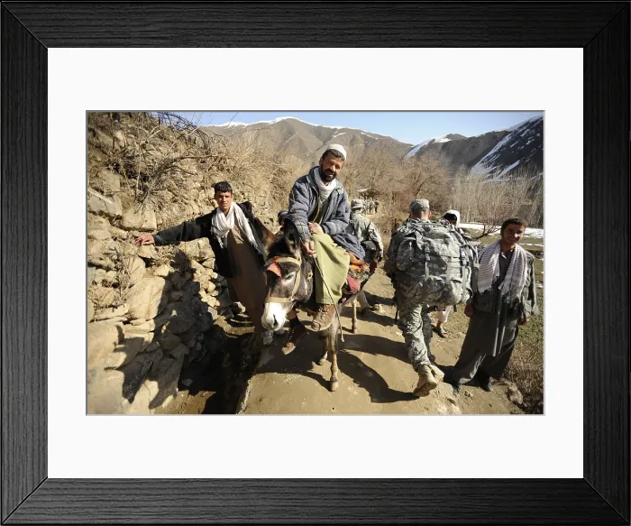 Framed Print : U.S. Army soldiers of the Panjshir Provincial Reconstruction Team walk past villagers in Panjshir Valley Afghanistan Mar. 5 2009. Photo by:Everett Collection(BSLOC_2011_6_96)