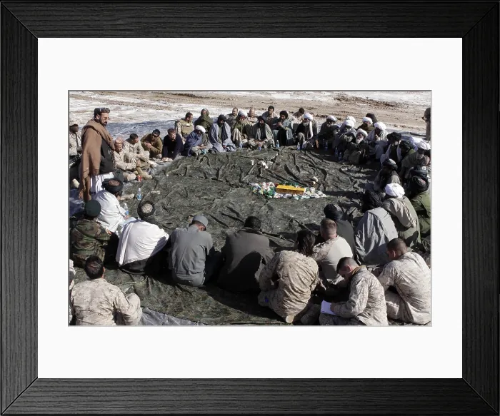 Framed Print : Haji Zahir district governor of Marjeh presided over a shura where he listened to the needs of the Shorshorak village elders