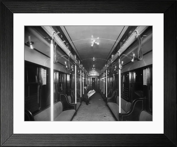 Framed Print : Solitary passenger in a commuter train in the new Holland Tunnel under the Hudson River connecting New York City and New Jersey public transit systems. Ca 1927 Framed Print : Solitary passenger in a commuter train in the new Holland Tunnel under the Hudson River connecting New York City and New Jersey public transit systems. Ca 1927