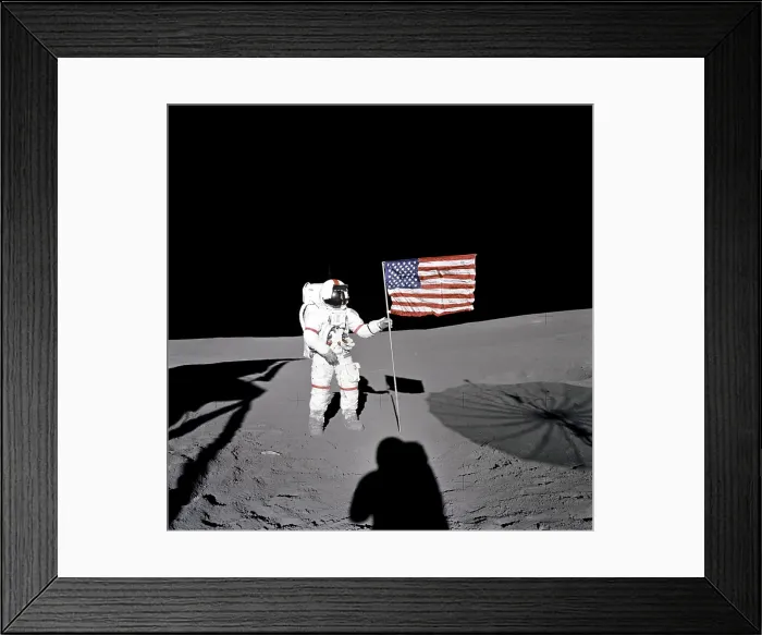 Framed Print : Apollo 14 Astronaut Alan B. Shepard stands by the US flag on the lunar Fra Mauro Highlands. 10 years earlier, Shepard made the first American manned space flight. Feb. 5, 1971