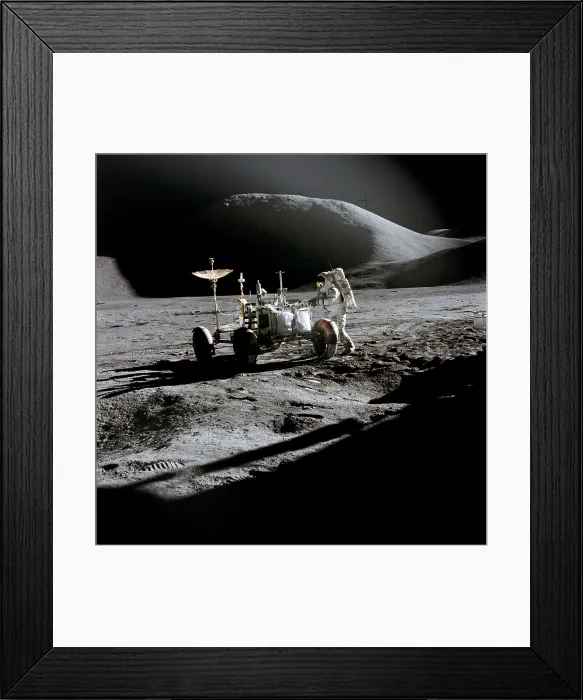 Framed Print : Apollo 15 astronaut James Irwin works at the Lunar Roving Vehicle at the Hadley-Apennine landing site. The shadow of the Lunar Module is in the foreground