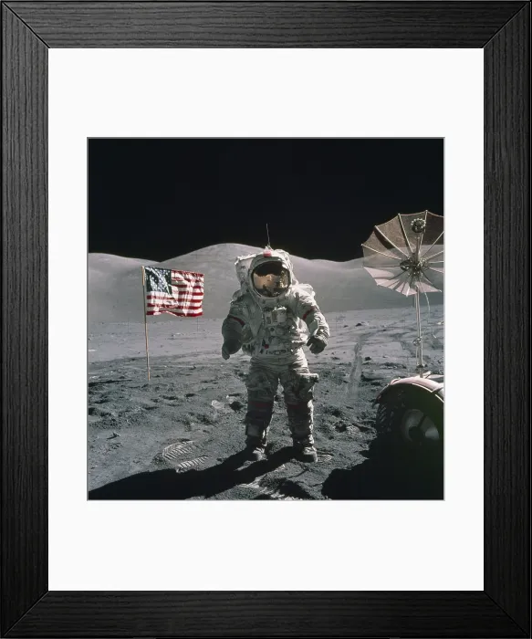 Framed Print : Apollo 17 Astronaut stands between a US flag and the Lunar Rover during the last US manned mission to the Moon. Dec. 12, 1971