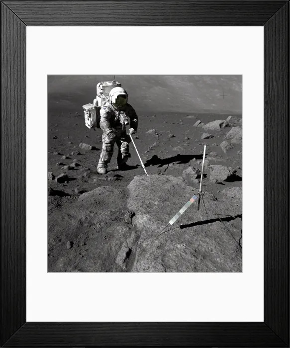 Framed Print : Apollo 17 Geologist-Astronaut Harrison Schmitt covered with lunar dirt. Schmitt scoops up lunar samples