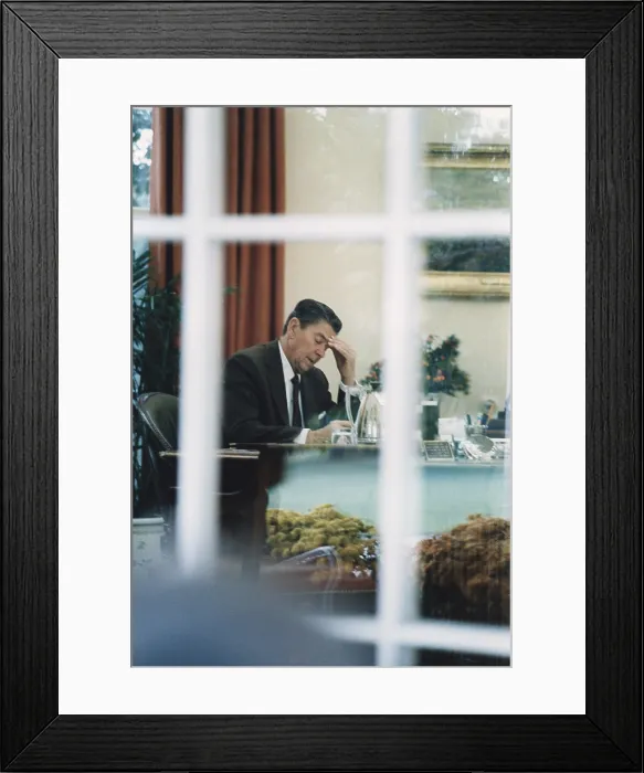 Framed Print : President Reagan working in the Oval Office drafting his speech to the nation on Lebanon and Grenada. October 27 1983. PO-USP-Reagan_NA-12-0082M