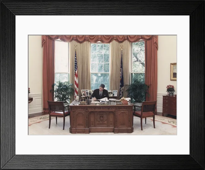 Framed Print : President Reagan working at his desk in the Oval Office. July 15 1988. PO-USP-Reagan_NA-12-0101M Framed Print : President Reagan working at his desk in the Oval Office. July 15 1988. PO-USP-Reagan_NA-12-0101M