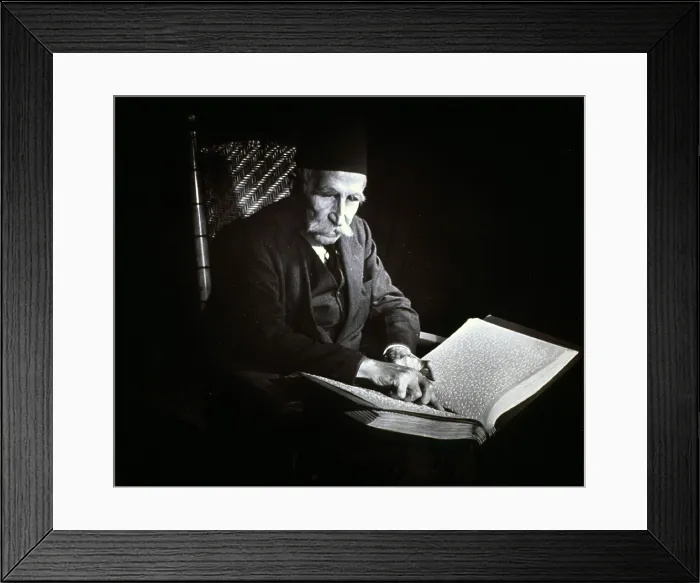 Framed Print : Blind man reading a Braille book, ca. 1938