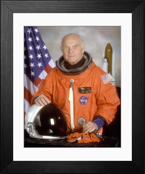 Framed Print : Astronaut John Glenn returned to space 36 years after his historic 1962 flight. He flew into space on the space shuttle at age 77 to study effects of space flight on the elderly