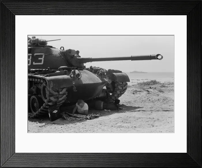 Framed Print : American soldiers reads in the shade under a US Marine tank in Beirut, Lebanon Framed Print : American soldiers reads in the shade under a US Marine tank in Beirut, Lebanon