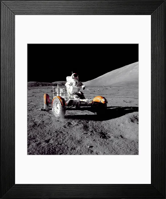 Framed Print : Apollo 17 Astronaut Eugene A. Cernan driving the Lunar Rover. The mountain in the background is the east end of South Massif. Nov. 11-14, 1972 Framed Print : Apollo 17 Astronaut Eugene A. Cernan driving the Lunar Rover. The mountain in the background is the east end of South Massif. Nov. 11-14, 1972