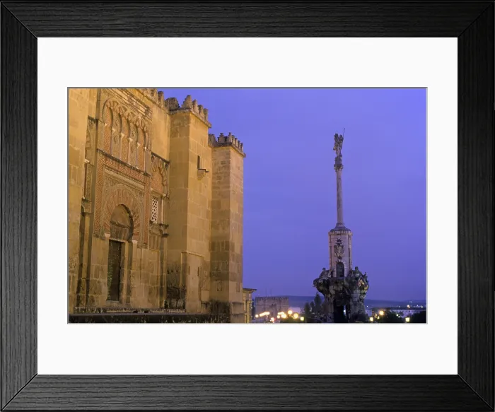 Framed Print : SPAIN. Cordoba. Mezquita (Mosque). At left Mosque-cathedrals walls and Triumph of San Rafael at right, in Torrijos street. Hispano-Moresque art. Caliphate period