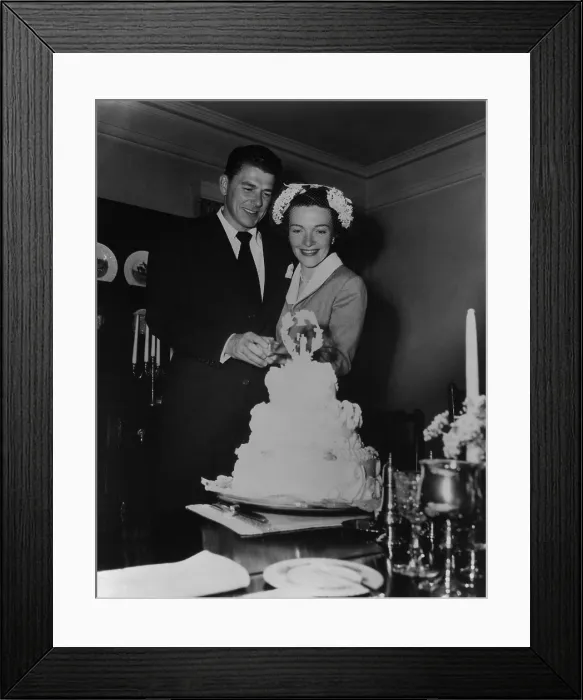 Framed Print : Newlyweds Ronald Reagan and Nancy Reagan cutting their wedding cake. March 4 1952. PO-USP-Reagan-Marriage_NA-12-0058M Framed Print : Newlyweds Ronald Reagan and Nancy Reagan cutting their wedding cake. March 4 1952. PO-USP-Reagan-Marriage_NA-12-0058M