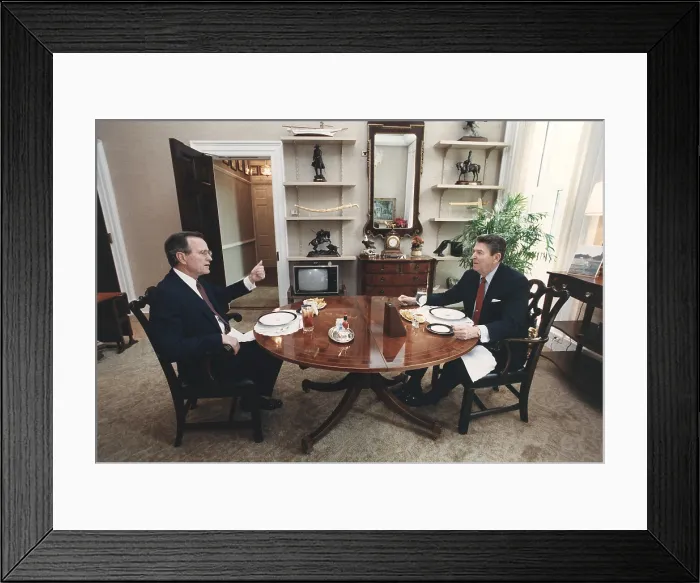 Framed Print : President Reagan and Vice-President Bush eating lunch in the Oval Office Study. Bush had established himself as the 1988 Republican nominees in the Super Tuesday primaries. Mar