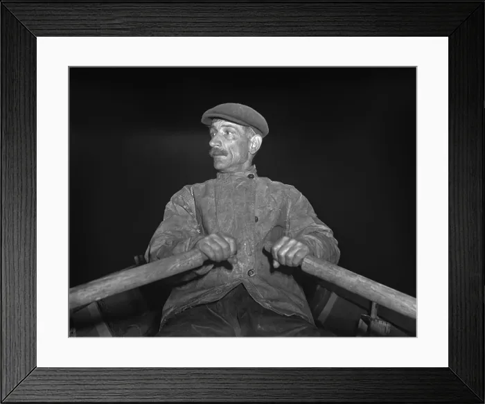 Framed Print : Portuguese dory fisherman rowing out to his boat at 4 30 in the morning for the fishing banks off Cape Cod. 1942. LC-USW38-002077-C