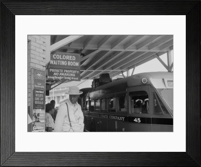 Framed Print : Colored Waiting Room sign. African Americans stand under a Jim Crow sign at the bus station in Durham, North Carolina. May 1940