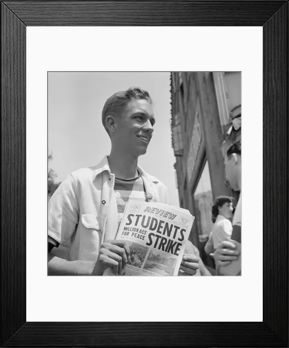 Framed Print : 1940 Peace Strike at Berkeley. Student selling Pacifist newspapers. This youth is an officer in the R.O.T.C. Reserve Officers Training Corps Framed Print : 1940 Peace Strike at Berkeley. Student selling Pacifist newspapers. This youth is an officer in the R.O.T.C. Reserve Officers Training Corps
